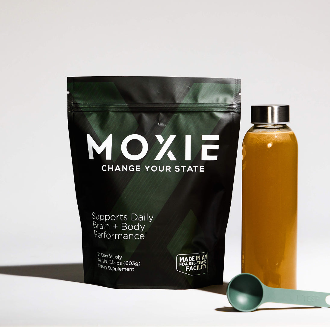 Photo of Moxie packaging with bottle of beverage and scoop